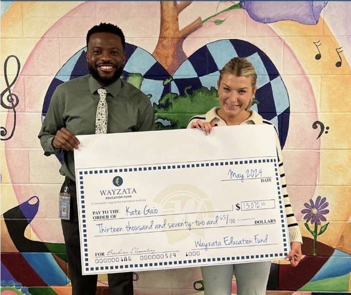 Birchview Elementary principal Ashley Farrington and teacher Kate Gaio pose with a grant funding specialized books for beginning readers